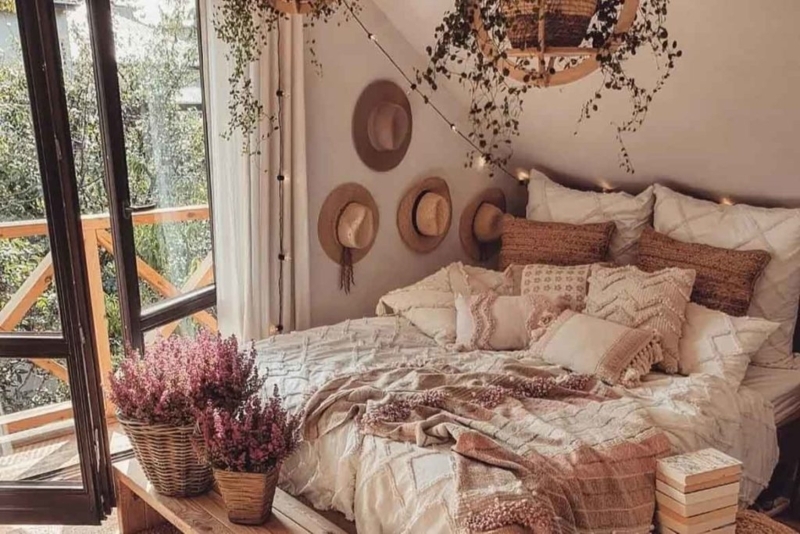 Platform Bed with Wall Mounted Hat Display in Boho Attic Bedroom