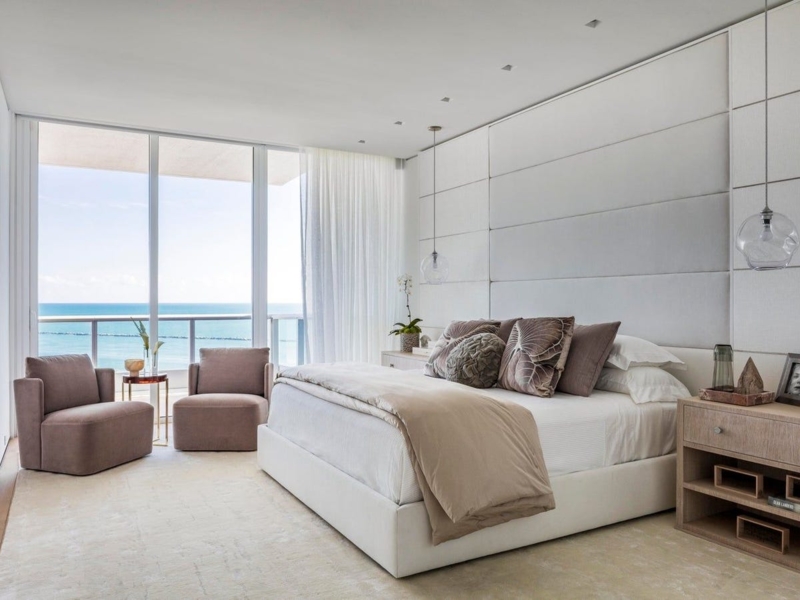Platform Bed with Wall-to-Wall Upholstered Headboard and Ocean View