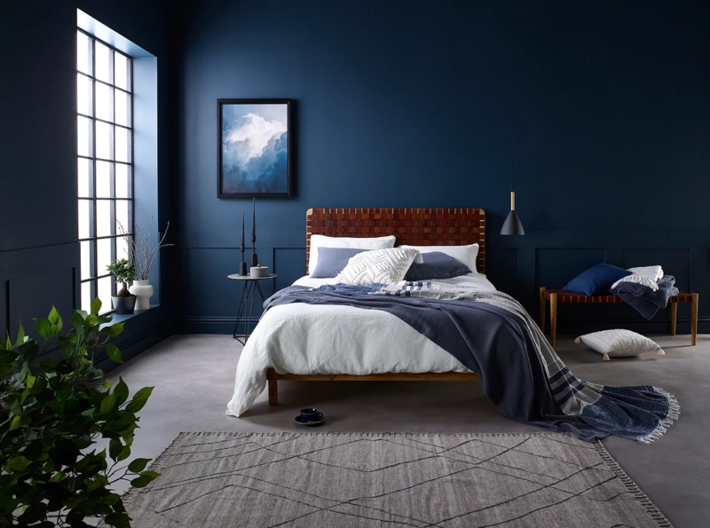 Platform Bed with Woven Headboard and Geometric Area Rug
