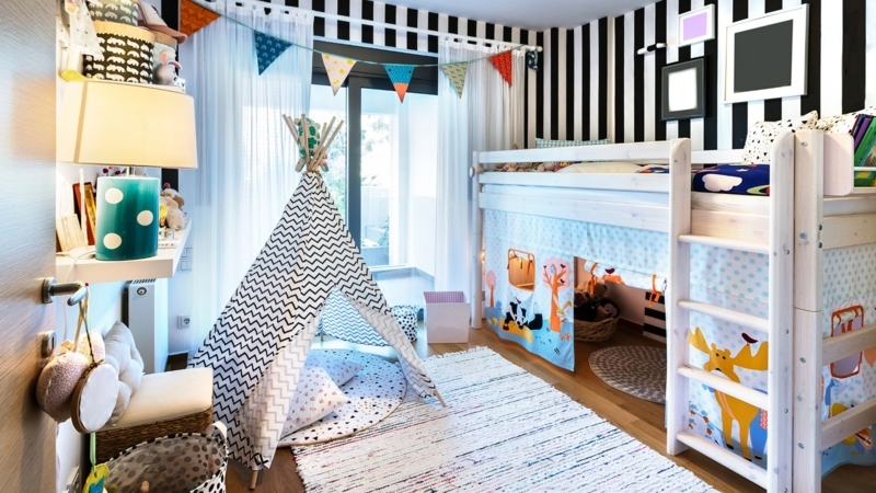 Playful Kids Bedroom with Patterned Teepee and Striped Wallpaper