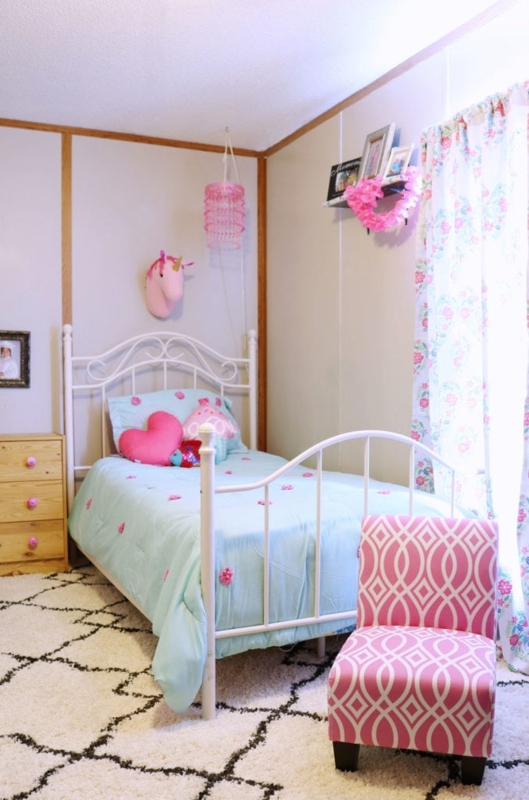 Playful Kids Bedroom with Pink Unicorn Decor and Metal Headboard