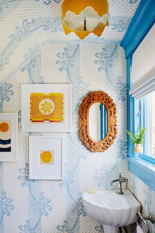 Powder Room: Blue Patterned Wallpaper, Ornate Wood Mirror, Shell Sink