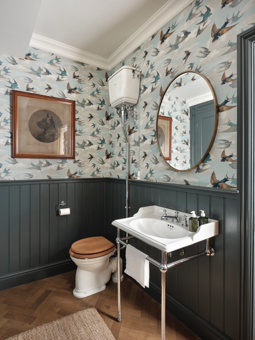 Powder Room Design: Bird Wallpaper, High Tank Cistern, and Herringbone