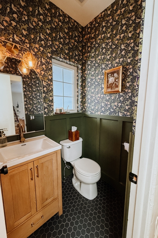 Powder Room Moody Style with Forest Green Paneling and Bird Wallpaper