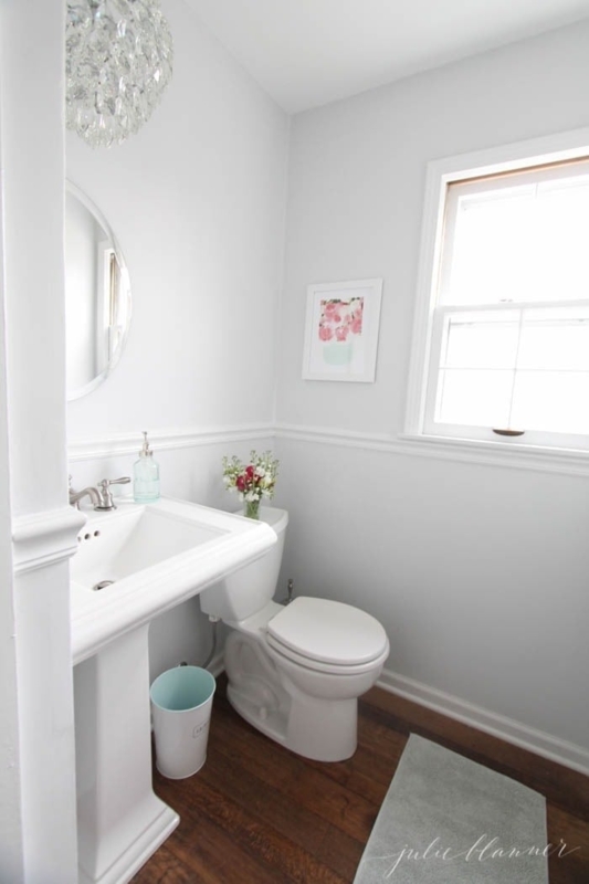 Powder Room Traditional Style with Pedestal Sink and Dark Wood Floors