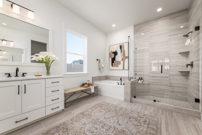 Primary Bathroom Design: Horizontal Stone Tile & Black Fixtures
