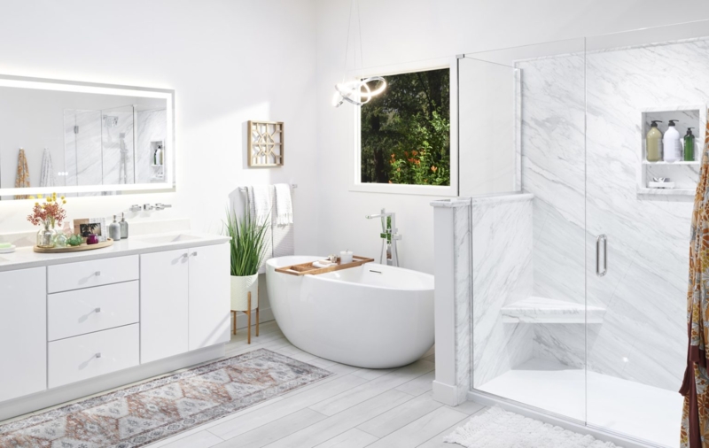 Primary Bathroom with Marbled Shower Walls and Soaker Tub