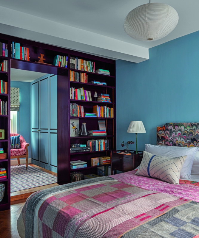 Purple Built-in Bookshelves Framing a Doorway in Maximalist Bedroom