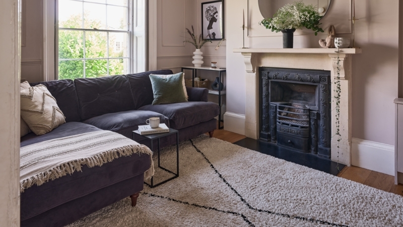Purple Velvet Sectional Sofa Ideas with Ornate Black Fireplace