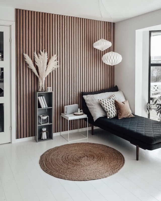 Quilted Daybed with Vertical Wood Slat Wall and Paper Lanterns