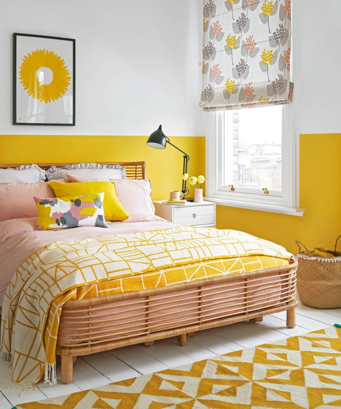 Rattan Bed Frame Against a Half-Painted Yellow Wall with Geometric Rug