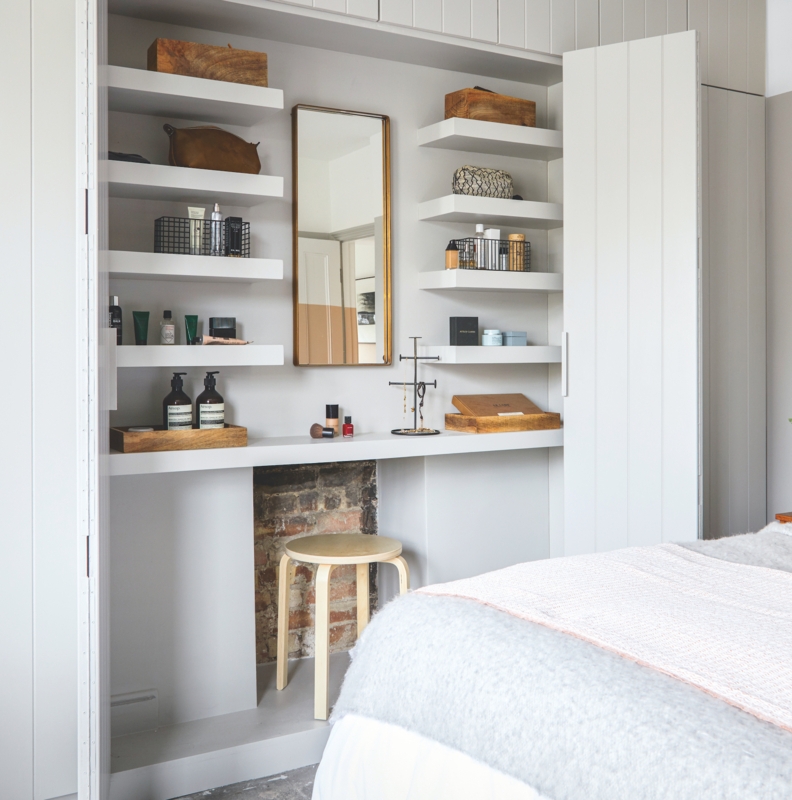 Recessed Vanity Alcove with Floating Shelves and Exposed Brick