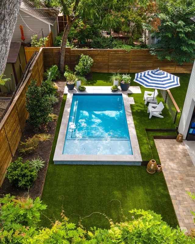 Rectangular Pool with Artificial Turf and Wood Fence