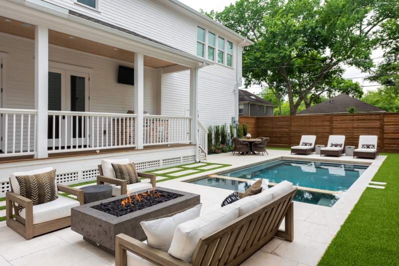 Rectangular Pool with Turf Strip Pavers and Fire Pit