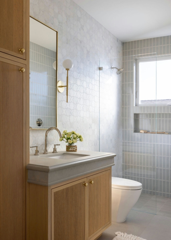 Reeded Wood Vanity with Thick Stone Counter and Geometric Tiles
