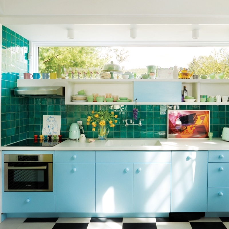 Retro Kitchen Design with Checkered Floor and Vibrant Teal Tiled Walls