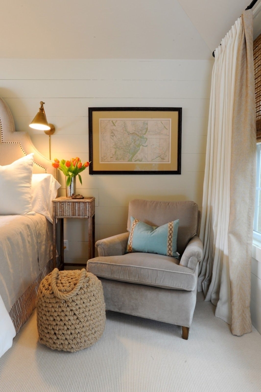 Rolled Arm Accent Chair with a Rope Pouf in a Cozy Bedroom Corner
