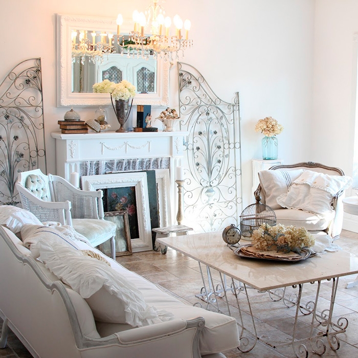 Romantic Living Room with Ornate Metal Wall Screens & Distressed Mantel