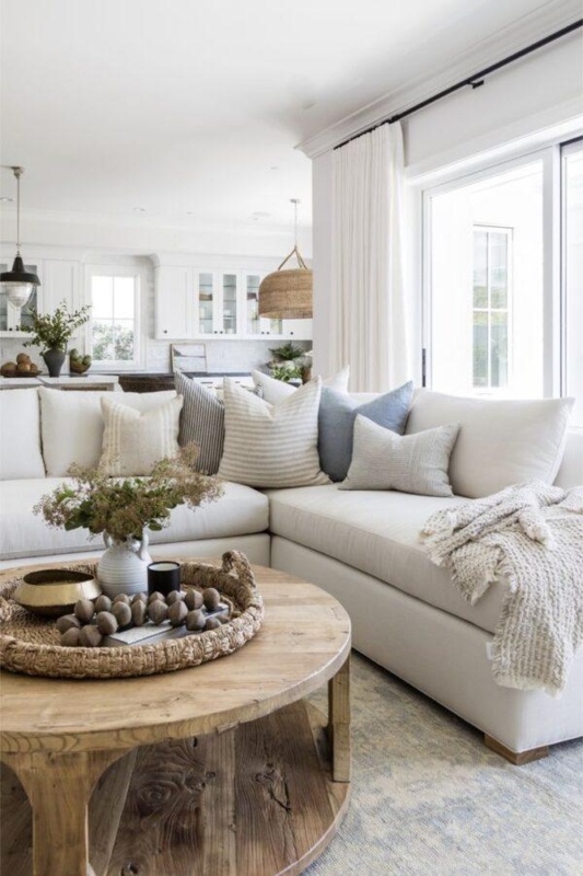 Round Rustic Wood Coffee Table in a Coastal Modern Living Room
