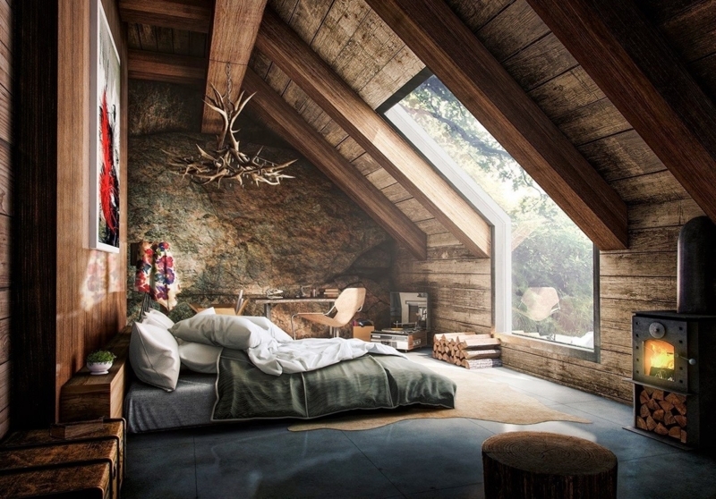 Rustic Attic Bedroom With Rock Wall Feature And Antler Chandelier