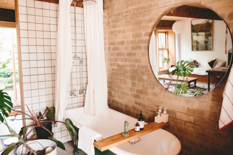 Rustic Bathroom with Brick Walls and Vintage Clawfoot Tub