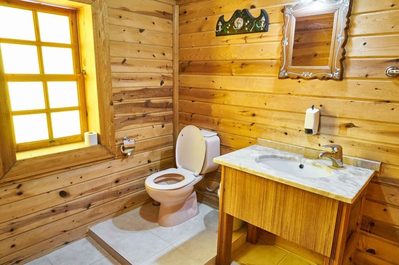 Rustic Bathroom Wood Paneling with Stone Topped Vanity
