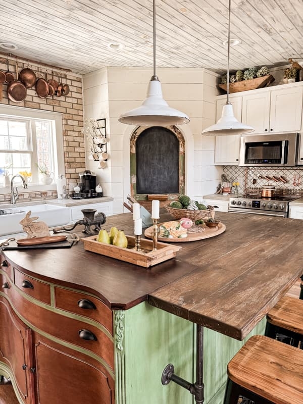 Rustic Farmhouse Kitchen Island with Pipe Footrest and Sage Green Base