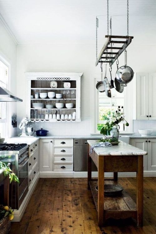 Rustic Farmhouse Kitchen with Ladder Pot Rack and Wood Island
