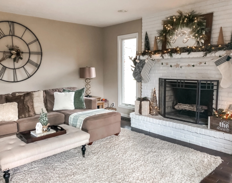 Rustic Farmhouse Living Room with White Brick Fireplace and Wall Clock