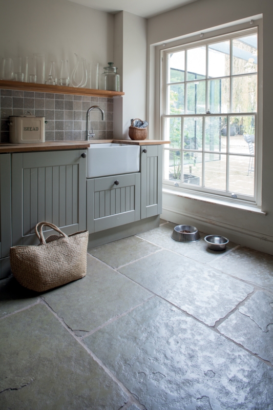 Rustic Flagstone Kitchen Flooring with Sage Green Beadboard Cabinets