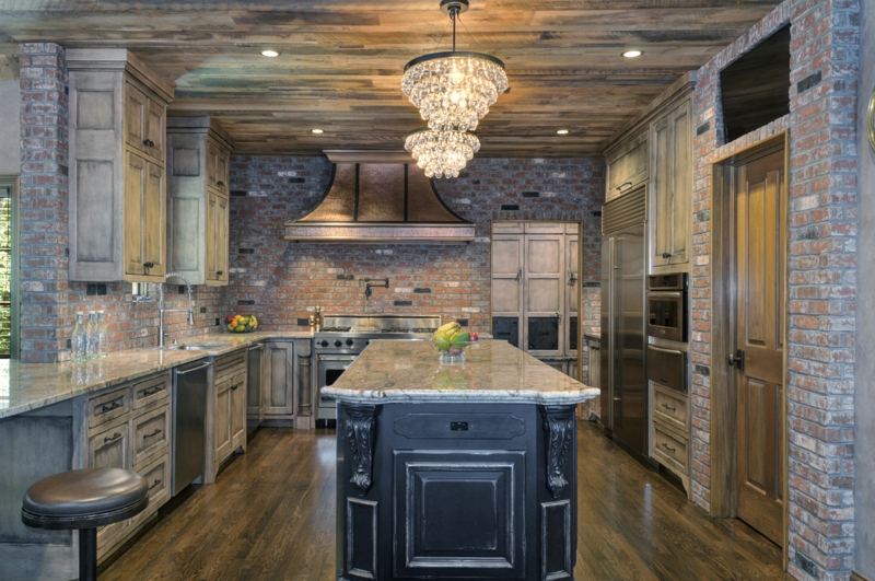 Rustic Kitchen Layout with Exposed Brick Walls & Hammered Copper Hood