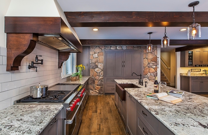 Rustic Kitchen Stone Accent Wall with Dark Wood Beam Ceiling