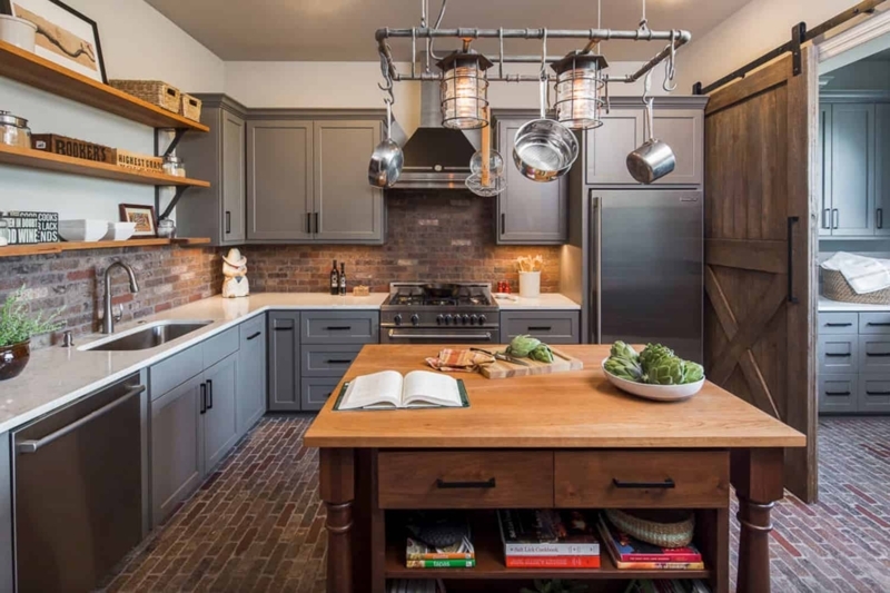 Rustic Kitchen with Brick Floor: Industrial Pipe Pot Rack