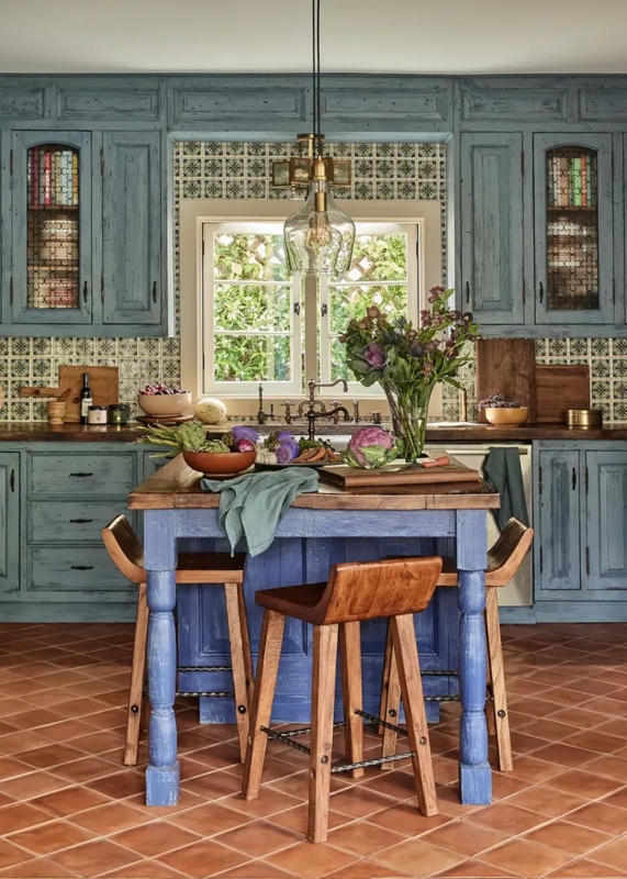Rustic Kitchen with Distressed Blue Finish and Terracotta Flooring
