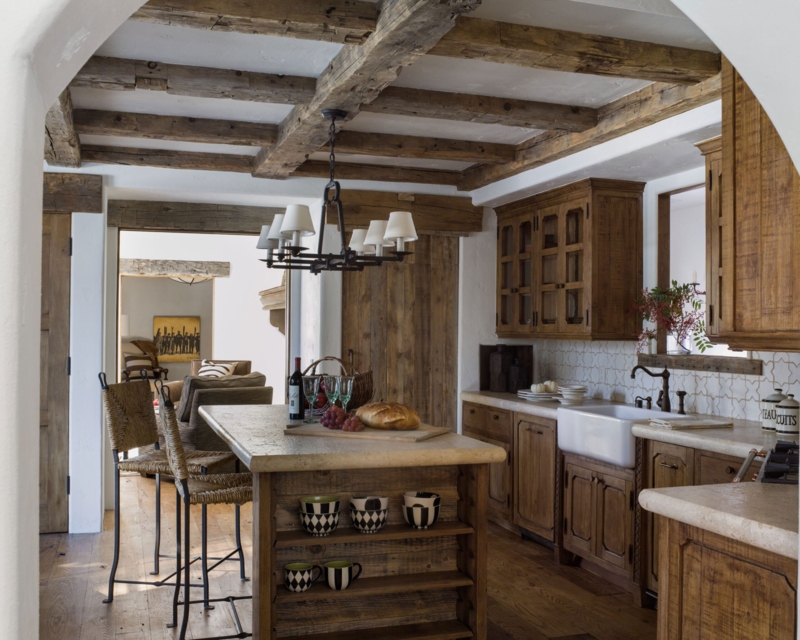 Rustic Kitchen with Exposed Beams and Woven Back Counter Stools