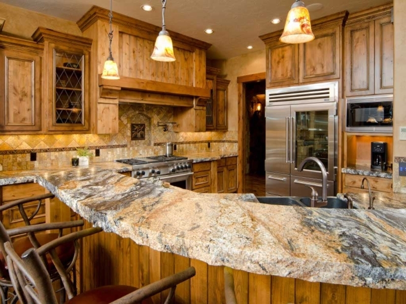 Rustic Live Edge Stone Breakfast Bar with Knotty Wood Cabinets