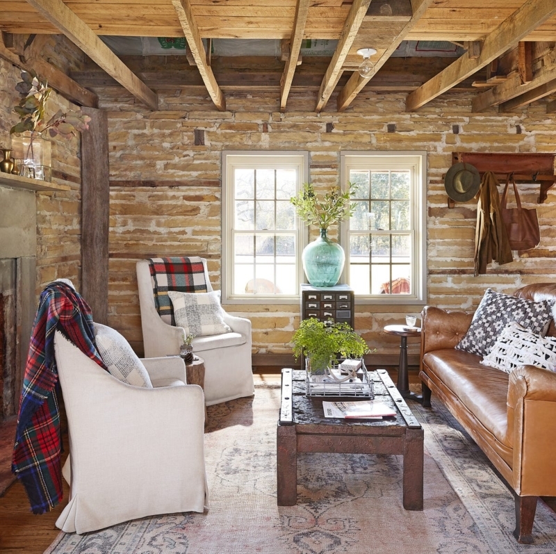 Rustic Living Room Stone Walls with Mixed Leather and Fabric Seating