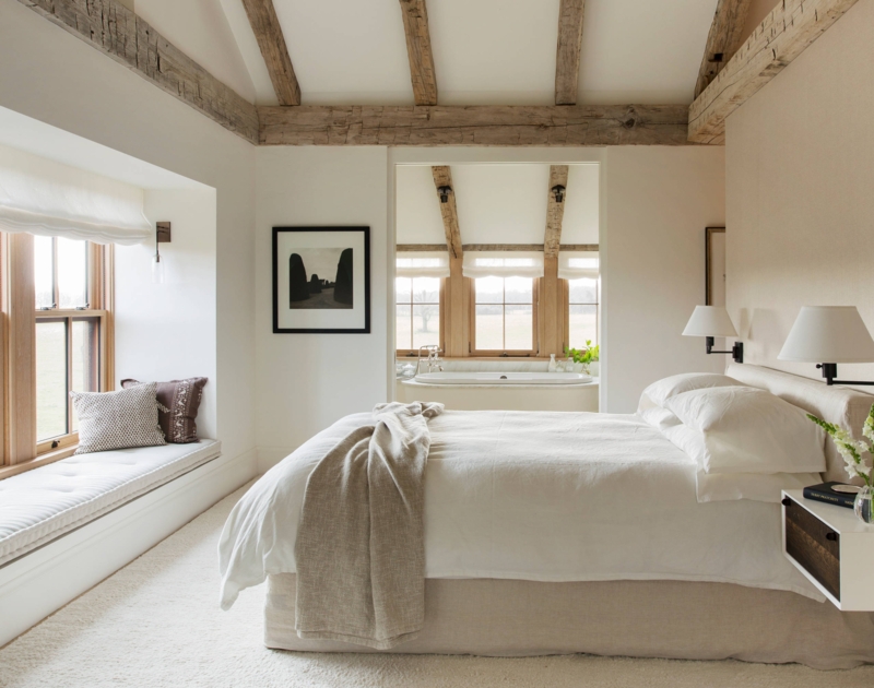 Rustic Modern Farmhouse Bedroom with Exposed Beams and Window Seat Nook