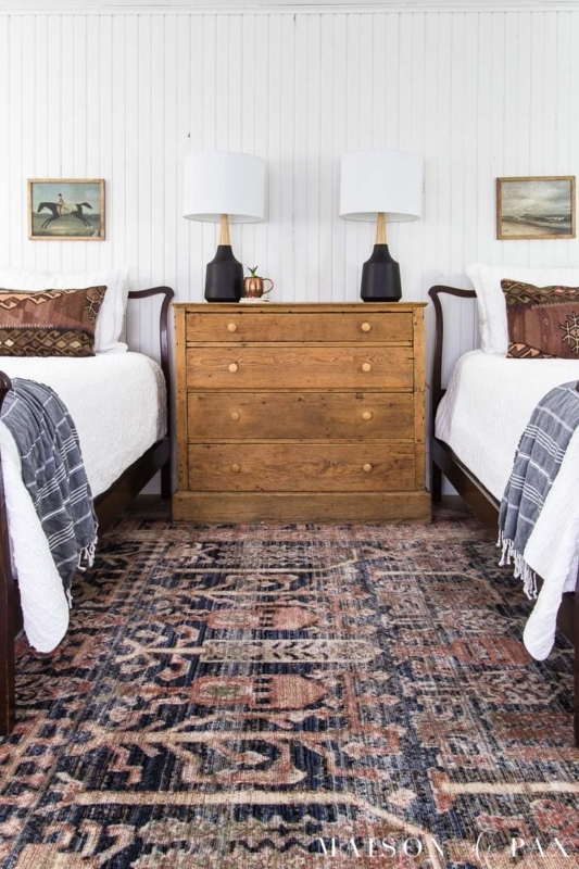 Rustic Modern Twin Bedroom with White Planked Walls and Shared Dresser