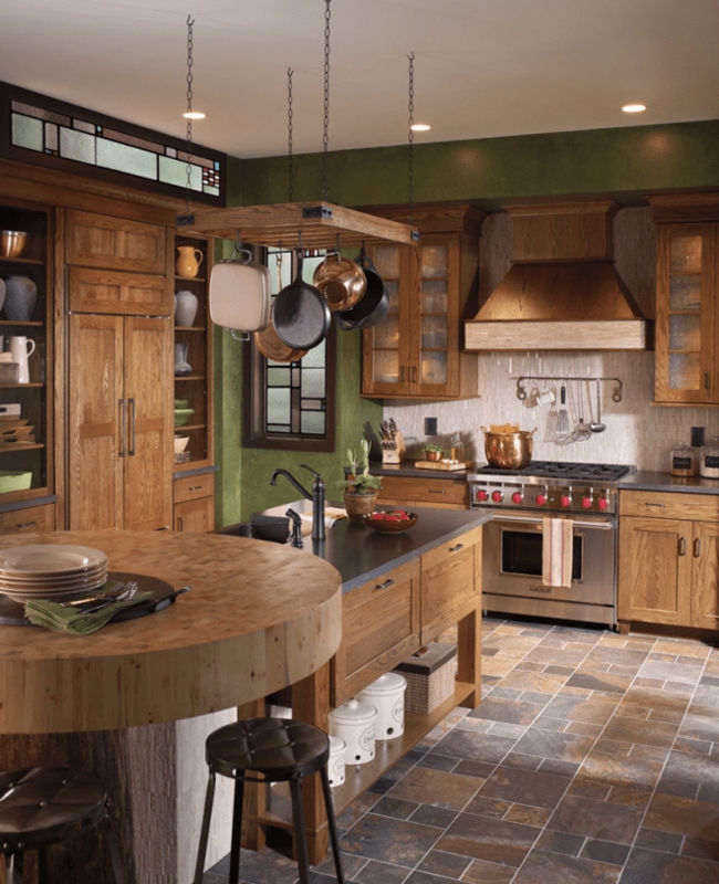 Rustic Oak Kitchen Cabinetry with Olive Green Walls and Pot Rack