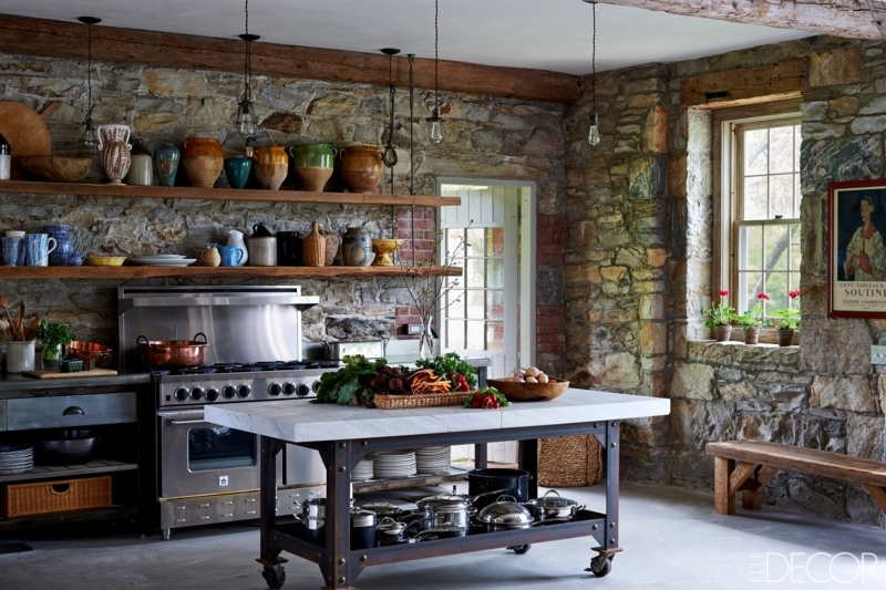 Rustic Stone Wall Kitchen Design with Industrial Rolling Prep Island