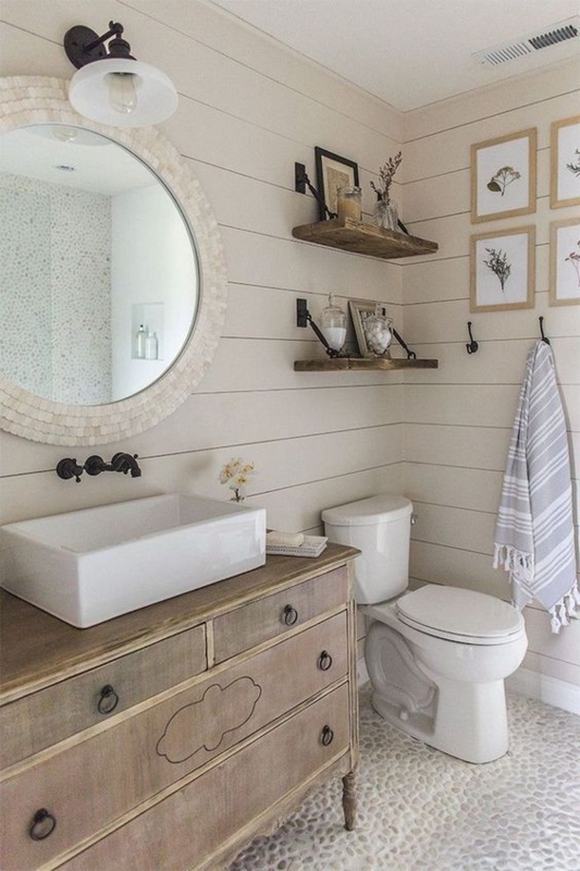Rustic Vanity with Vessel Sink, Beige Shiplap Walls, and Pebble Flooring