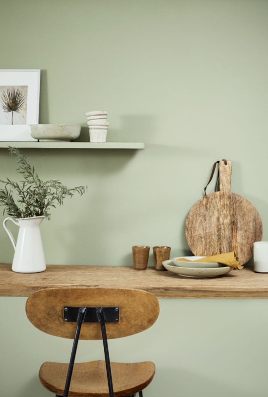 Rustic Wood Desk and Side Chair against Sage Green Wall with Shelf