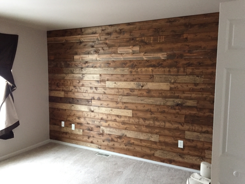 Rustic Wood Wall Paneling with Staggered Plank Pattern