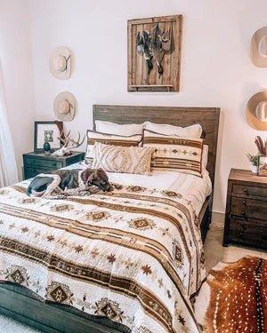 Rustic Wooden Bed with Southwestern Pattern Quilt and Hat Display