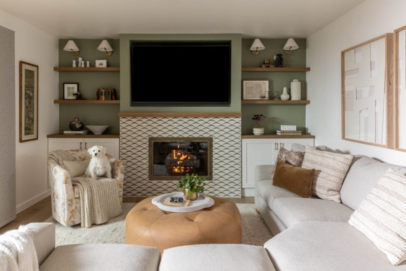 Sage Green Built-In Shelving Framing Patterned Tiled Fireplace