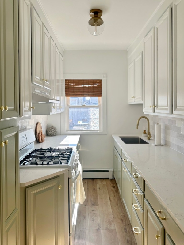 Sage Green Galley Kitchen Design with Two-Tone Cabinets