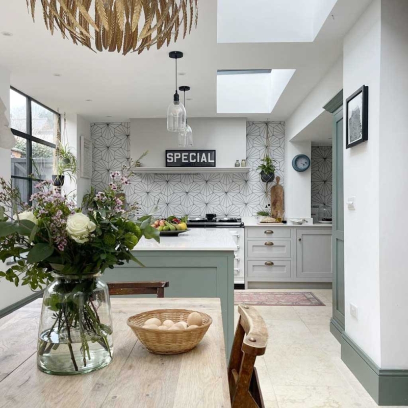 Sage Green Island Kitchen with Geometric Tile and Gold Chandelier