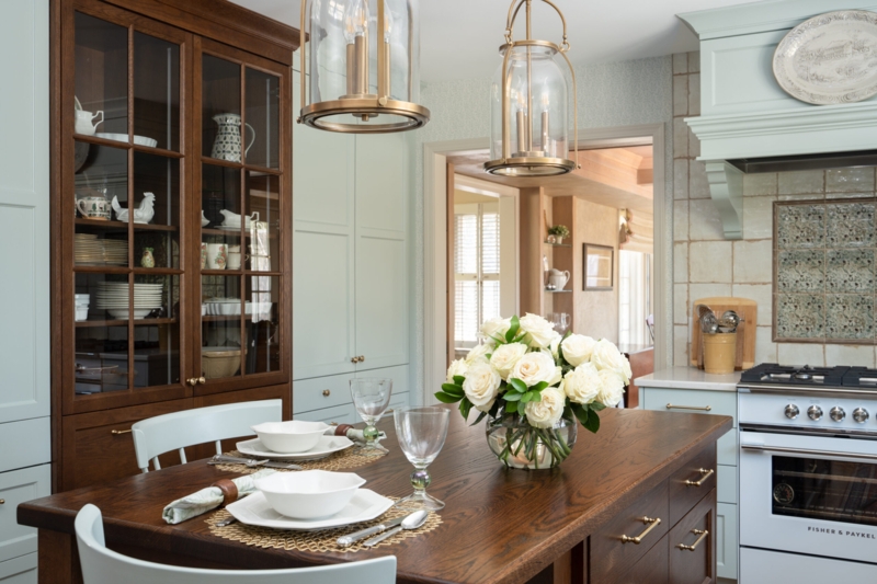 Sage Green Kitchen Cabinets, Brass Lantern Pendants, Dark Wood Hutch