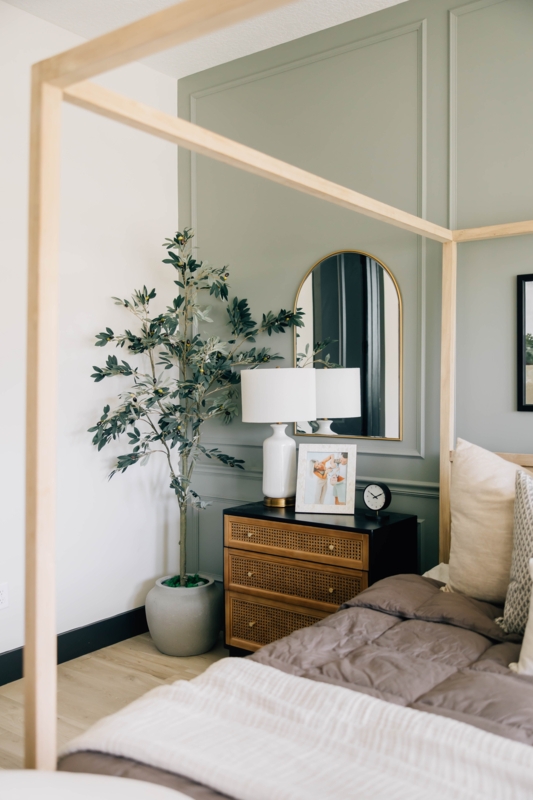 Sage Green Paneled Accent Wall with Gold Arched Mirror
